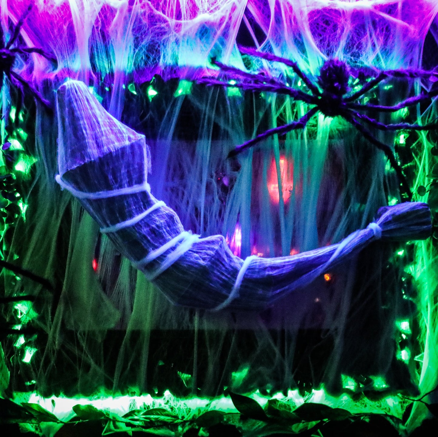 Mummy in a dark, eerie forest with glowing green and purple lights